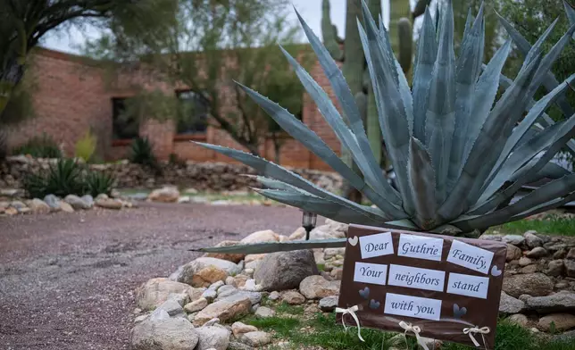 A sign of solidarity from neighbors at Nancy Guthrie's home Thursday, Feb. 5, 2026, in Tucson, Ariz. (AP Photo/Caitlin O'Hara)