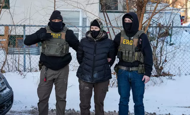 An activist is detained by federal agents on Tuesday, Feb. 3, 2026, in Minneapolis. (AP Photo/Ryan Murphy)