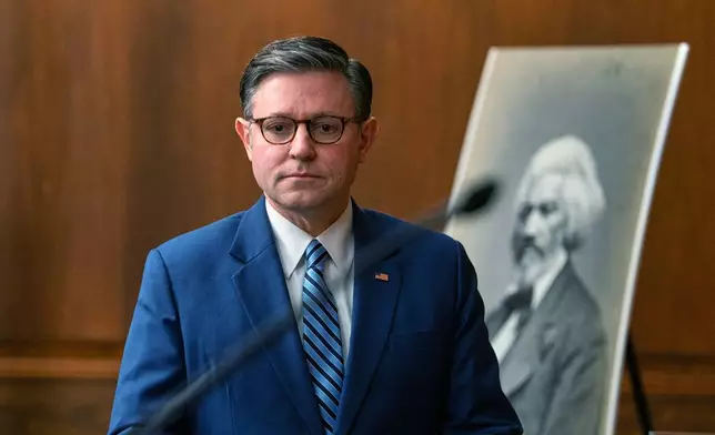 Speaker Mike Johnson, R-La., arrives to the Frederick Douglass Press Gallery dedication at the Capitol, Thursday, Feb. 12, 2026, in Washington. (AP Photo/Allison Robbert)
