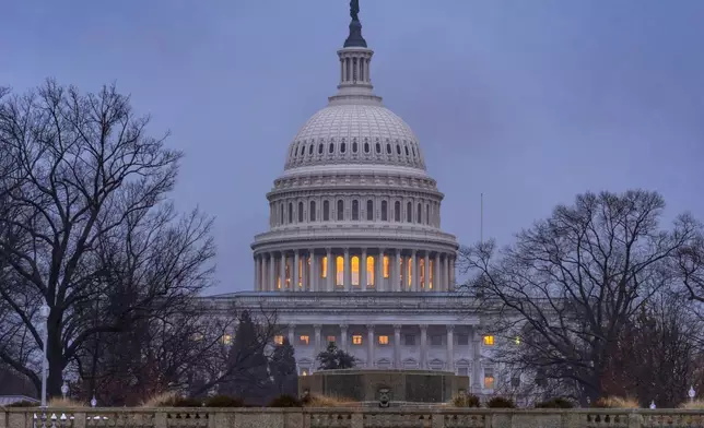 The Capitol is seen during heavy rain as the Department of Homeland Security funding bill remains in limbo, in Washington, Friday, Feb. 20, 2026. (AP Photo/J. Scott Applewhite)