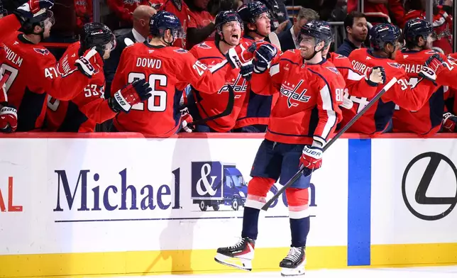 Washington Capitals left wing Pierre-Luc Dubois (80) celebrates his second goal of the game during the second period of an NHL hockey game against the Vegas Golden Knights, Friday, Feb. 27, 2026, in Washington. (AP Photo/Nick Wass)