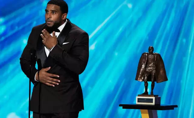 Washington Commanders' Bobby Wagner accepts the Walter Payton NFL Man of the Year award during the NFL Honors award show, Thursday, Feb. 5, 2026, in San Francisco. (AP Photo/Charlie Riedel)
