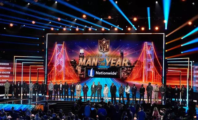 The Walter Payton NFL Man of the Year nominees stand on the stage during the NFL Honors award show, Thursday, Feb. 5, 2026, in San Francisco. (AP Photo/Charlie Riedel)