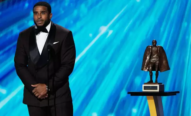Washington Commanders' Bobby Wagner accepts the Walter Payton NFL Man of the Year award during the NFL Honors award show, Thursday, Feb. 5, 2026, in San Francisco. (AP Photo/Charlie Riedel)