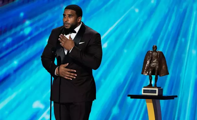 Washington Commanders' Bobby Wagner accepts the Walter Payton NFL Man of the Year award during the NFL Honors award show, Thursday, Feb. 5, 2026, in San Francisco. (AP Photo/Charlie Riedel)