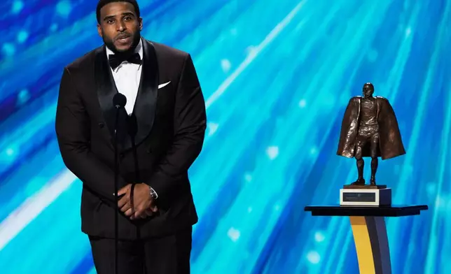Washington Commanders' Bobby Wagner accepts the Walter Payton NFL Man of the Year award during the NFL Honors award show, Thursday, Feb. 5, 2026, in San Francisco. (AP Photo/Charlie Riedel)