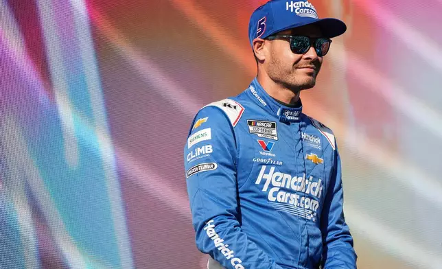 FILE - Kyle Larson looks on prior to a NASCAR Cup Series auto race at Darlington Raceway, Aug. 31, 2025, in Darlington, S.C. (AP Photo/Matt Kelley, File)