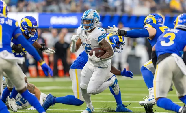 FILE - Detroit Lions running back David Montgomery (5) runs the ball against the Los Angeles Rams in an NFL football game, Dec. 14, 2025, in Inglewood, Calif. (AP Photo/Jeff Lewis, File)