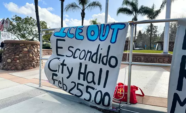 A sing advertises an upcoming rally on Wednesday, Feb. 18, 2026 in Escondido, Calif. (AP Photo/Amy Taxin)