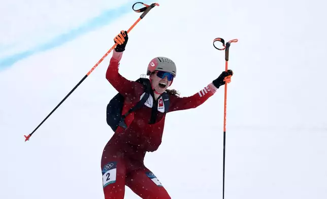 Switzerland's Marianne Fatton celebrates winning a ski mountaineering women's final at the 2026 Winter Olympics, in Bormio, Italy, Thursday, Feb. 19, 2026. (AP Photo/Gabriele Facciotti)