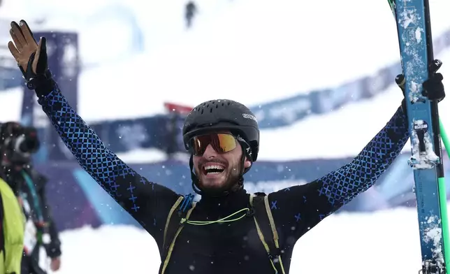Individual Neutral Athlete Nikita Filippov celebrates winning the silver medal in a ski mountaineering men's final at the 2026 Winter Olympics, in Bormio, Italy, Thursday, Feb. 19, 2026. (AP Photo/Gabriele Facciotti)