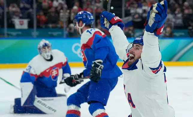 United States' Dylan Larkin (21) celebrates after scoring the opening goal during a men's ice hockey semifinal game between United States and Slovakia at the 2026 Winter Olympics, in Milan, Italy, Friday, Feb. 20, 2026. (AP Photo/Petr David Josek)