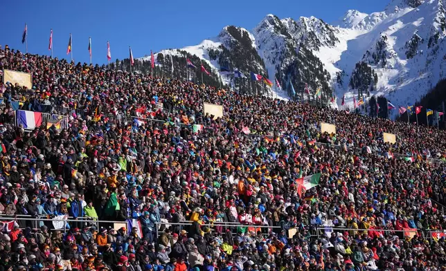 Spectators watch the start of the women's 10-kilometer pursuit biathlon race at the 2026 Winter Olympics in Anterselva, Italy, Sunday, Feb. 15, 2026. (AP Photo/Andrew Medichini)