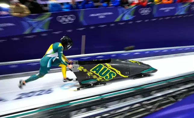 Australia's Bree Walker starts for a women's monobob run at the 2026 Winter Olympics, in Cortina d'Ampezzo, Italy, Sunday, Feb. 15, 2026. (AP Photo/Aijaz Rahi)