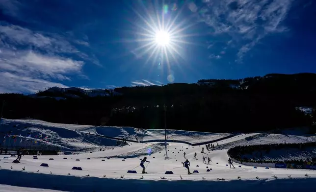 Athletes compete in the cross country skiing men's 4 x 7.5km relay at the 2026 Winter Olympics, in Tesero, Italy, Sunday, Feb. 15, 2026. (AP Photo/Matthias Schrader)