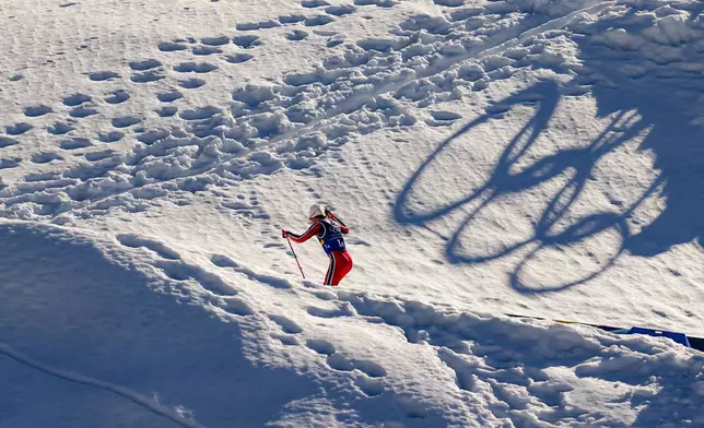 Johannes Hoesflot Klaebo, of Norway, skis uphill during the cross country skiing men's 4 x 7.5km relay at the 2026 Winter Olympics, in Tesero, Italy, Sunday, Feb. 15, 2026. (AP Photo/Matthias Schrader)