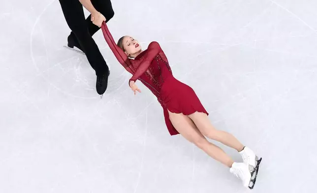 Minerva Fabienne Hase and Nikita Volodin of Germany compete during the pairs figure skating short program at the 2026 Winter Olympics, in Milan, Italy, Sunday, Feb. 15, 2026. (AP Photo/Bernat Armangue)