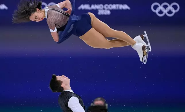 Camille Kovalev and Pavel Kovalev of France compete during the pairs figure skating short program at the 2026 Winter Olympics, in Milan, Italy, Sunday, Feb. 15, 2026. (AP Photo/Ashley Landis)