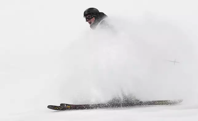 France's Matias Roche celebrates during the men's freestyle skiing big air qualifications at the 2026 Winter Olympics, in Livigno, Italy, Sunday, Feb. 15, 2026. (AP Photo/Lindsey Wasson)