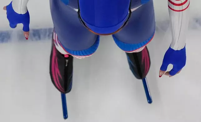 Sarah Warren of the United States takes the start of the speed skating women's 500m at the 2026 Winter Olympics, in Milan, Italy, Sunday, Feb. 15, 2026. (AP Photo/Christophe Ena)