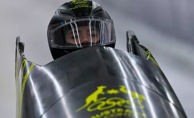 Australia's Bree Walker starts for a women's monobob run at the 2026 Winter Olympics, in Cortina d'Ampezzo, Italy, Sunday, Feb. 15, 2026. (AP Photo/Aijaz Rahi)
