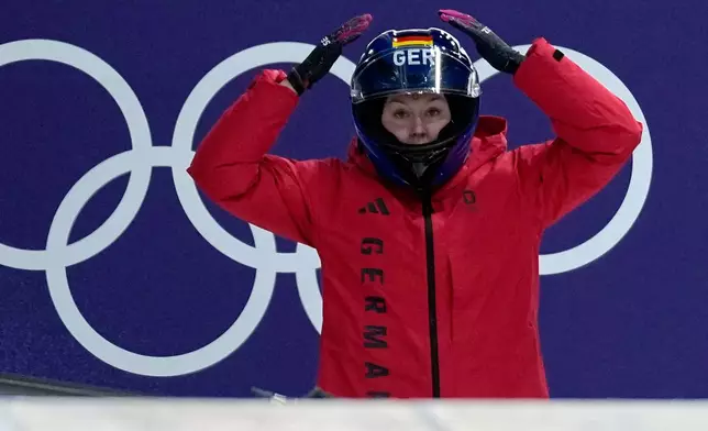 Germany's Laura Nolte prepares to start for a women's monobob run at the 2026 Winter Olympics, in Cortina d'Ampezzo, Italy, Sunday, Feb. 15, 2026. (AP Photo/Aijaz Rahi)