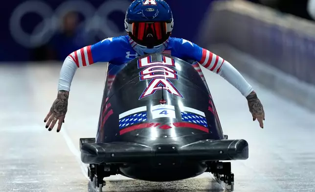 United States' Kaillie Armbruster Humphries starts for a women's monobob run at the 2026 Winter Olympics, in Cortina d'Ampezzo, Italy, Sunday, Feb. 15, 2026. (AP Photo/Aijaz Rahi)
