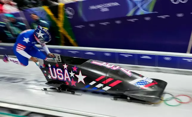 United States' Elana Meyers Taylor starts for a women's monobob run at the 2026 Winter Olympics, in Cortina d'Ampezzo, Italy, Sunday, Feb. 15, 2026. (AP Photo/Aijaz Rahi)