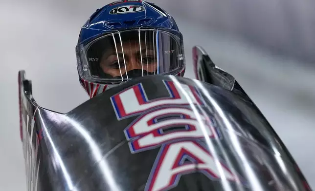 United States' Kaysha Love starts for a women's monobob run at the 2026 Winter Olympics, in Cortina d'Ampezzo, Italy, Sunday, Feb. 15, 2026. (AP Photo/Aijaz Rahi)