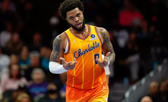 FILE - Charlotte Hornets forward Miles Bridges makes the "6-7" motion after scoring against the Washington Wizards during the second half of an NBA basketball game in Charlotte, N.C., Jan. 24, 2026. (AP Photo/Nell Redmond, file)