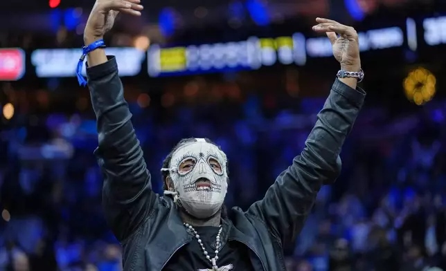 FILE - Rapper Skrilla reacts during an NBA basketball game Thursday, Dec. 4, 2025, in Philadelphia. (AP Photo/Matt Slocum)