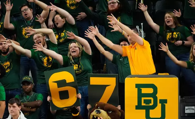 FILE - Baylor fans holding up a 6-7 sign cheer during an NCAA college basketball game against BYU, Feb. 10, 2026, in Waco, Texas. (AP Photo/Tony Gutierrez, file)