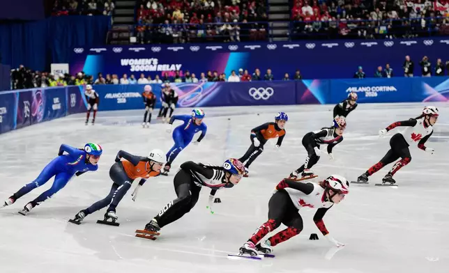 Team Italy, Team Netherlands, Team Korea and Team Canada compete during the short track speed skating women's team 3000m relay at the 2026 Winter Olympics, in Milan, Italy, Wednesday, Feb. 18, 2026. (AP Photo/Ashley Landis)