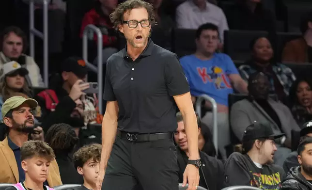 Atlanta Hawks head coach Quin Snyder gestures during the first half of an NBA basketball game against the Miami Heat Tuesday, Feb. 3, 2026, in Miami. (AP Photo/Marta Lavandier)