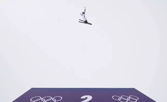 United States' Connor Curran (5-2) practices before the freestyle skiing mixed team aerials final at the 2026 Winter Olympics, in Livigno, Italy, Saturday, Feb. 21, 2026. (AP Photo/Lindsey Wasson)