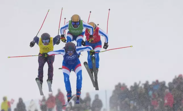 From left, Great Britain's Oliver Davies (28), France's Youri Duplessis-Kergomard (21), France's Terence Tchiknavorian (12) and Germany's Florian Wilmsmann (4) compete during the men's ski cross finals at the 2026 Winter Olympics, in Livigno, Italy, Saturday, Feb. 21, 2026. (AP Photo/Julia Demaree Nikhinson)