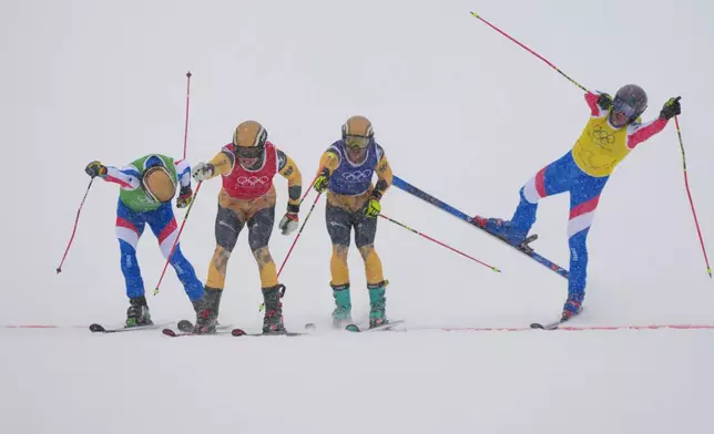 From left, France's Terence Tchiknavorian (12), Germany's Florian Wilmsmann (4), Germany's Cornel Renn (20) and France's Youri Duplessis-Kergomard (21) compete during the men's ski cross final at the 2026 Winter Olympics, in Livigno, Italy, Saturday, Feb. 21, 2026. (AP Photo/Julia Demaree Nikhinson)