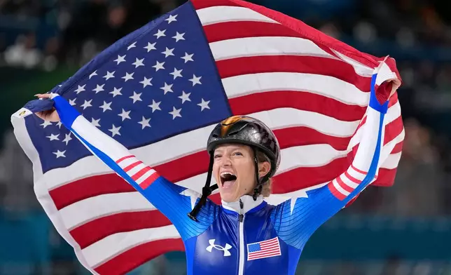 Mia Manganello of the U.S. celebrates winning the bronze medal in the women's mass start final speedskating race at the 2026 Winter Olympics, in Milan, Italy, Saturday, Feb. 21, 2026. (AP Photo/Ben Curtis)