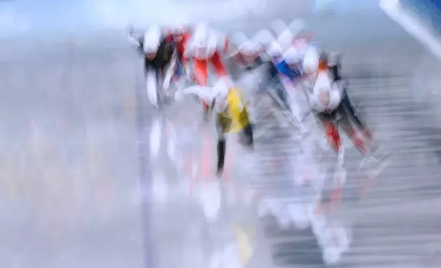 Athletes compete in the women's mass start semifinal speedskating races at the 2026 Winter Olympics, in Milan, Italy, Saturday, Feb. 21, 2026. (AP Photo/Luca Bruno)