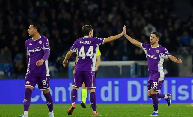 Fiorentina's Manor Salomon, right, celebrates after scoring during the Italian Serie A soccer match between Napoli and Fiorentina in Naples, Italy, Saturday, Jan. 31, 2026. (Alessandro Garofalo/LaPresse via AP)