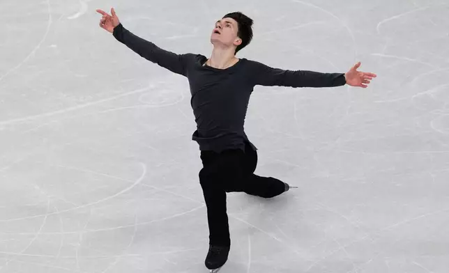 Maxim Naumov of the United States competes during the men's free skate program in figure skating at the 2026 Winter Olympics, in Milan, Italy, Friday, Feb. 13, 2026. (AP Photo/Francisco Seco)