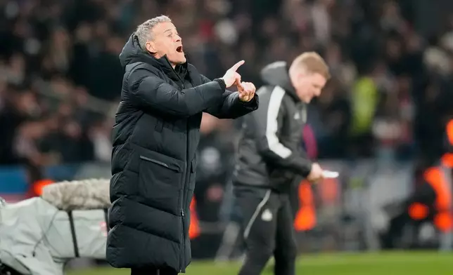 PSG's coach Luis Enrique gestures during a Champions League opening phase soccer match between Paris Saint-Germain and Newcastle in Wednesday, Jan. 28, 2026. (AP Photo/Michel Euler)