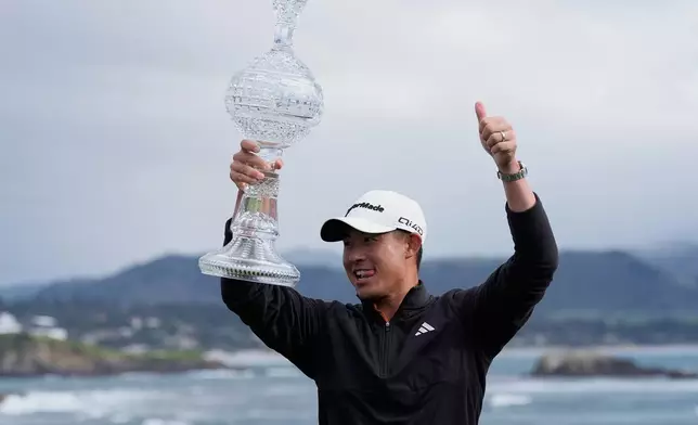 Collin Morikawa celebrates at Pebble Beach Golf Links after winning the AT&amp;T Pebble Beach Pro-Am golf tournament in Pebble Beach, Calif., Sunday, Feb. 15, 2026. (AP Photo/Godofredo A. Vásquez)
