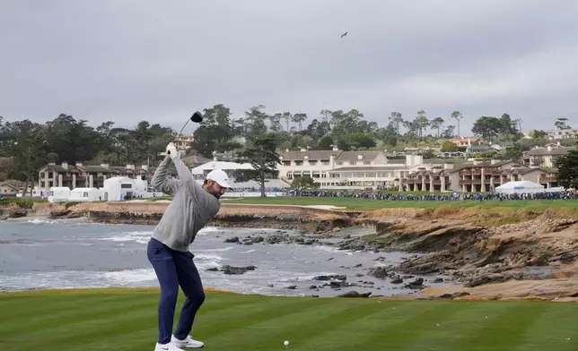 Scottie Scheffler hits from the 18th tee at Pebble Beach Golf Links during the final round of the AT&amp;T Pebble Beach Pro-Am golf tournament in Pebble Beach, Calif., Sunday, Feb. 15, 2026. (AP Photo/Godofredo A. Vásquez)