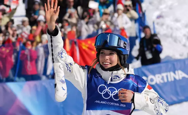 Gold medalist China's Eileen Gu celebrates winning the women's freestyle skiing halfpipe final at the 2026 Winter Olympics, in Livigno, Italy, Sunday, Feb. 22, 2026. (AP Photo/Abbie Parr)