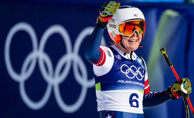 Breezy Johnson of the United States reacts in the finish area of the alpine ski women's downhill race, at the 2026 Winter Olympics, in Cortina d'Ampezzo, Italy, Sunday, Feb. 8, 2026. (Jean-Christophe Bott, Keystone via AP)