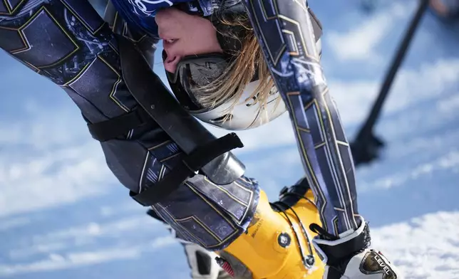 Czechia's Ester Ledecka warms up during the women's snowboarding parallel giant slalom finals at the 2026 Winter Olympics, in Livigno, Italy, Sunday, Feb. 8, 2026. (AP Photo/Gregory Bull)
