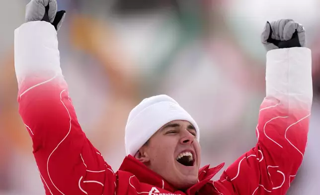 Switzerland's Franjo von Allmen celebrates winning the gold medal in a men's super-G race, at the 2026 Winter Olympics, in Bormio, Italy, Wednesday, Feb.11, 2026. (AP Photo/Julia Demaree Nikhinson)