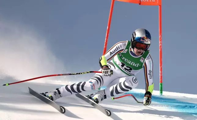 Germany's Emma Aicher speeds down the course during a women's World Cup super-G race, in Soldeu, Andorra, Saturday, Feb. 28, 2026. (AP Photo/Gabriele Facciotti)