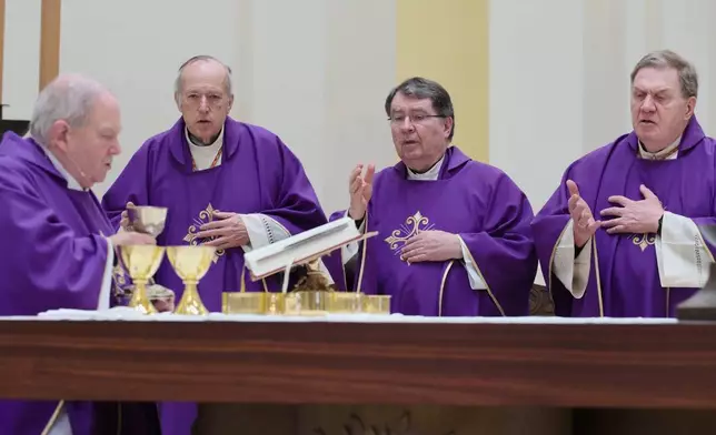 Archbishop Bernard Hebda, and Cardinals Robert McElroy, Christophe Pierre and Joseph Tobin celebrate a mass in solidarity with migrants at the Chapel of St. Thomas Aquinas on Friday, Feb. 27, 2026 in St. Paul, Minn. (AP Photo/Mark Vancleave)